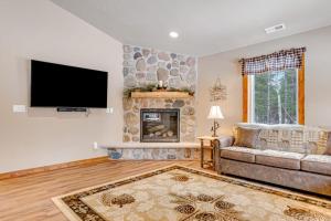 a living room with a couch and a fireplace at The Fish in Conover