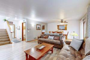 a living room with a couch and a table at Knotty Pines in Wisconsin Dells