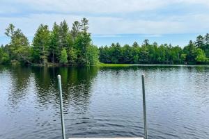 a view of a large lake with trees in the background at The Aspen in Mercer
