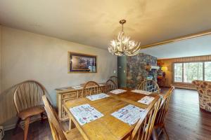 a dining room with a wooden table and chairs at Wild Bear Retreat in Saint Germain