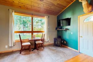 a dining room with a table and a window at Gateway Lodge in Mercer