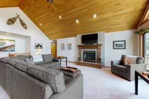 a living room with two couches and a fireplace at Blissful St Germain Retreat in Saint Germain