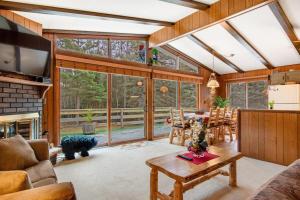 a living room with a couch and a table at Catfish Lake Home in Eagle River