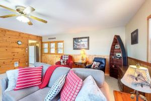 a living room with a couch and a ceiling fan at Briar's Hideaway in Phelps