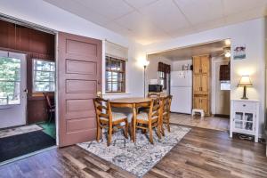 a kitchen and dining room with a table and chairs at West Bay Pines in Saint Germain