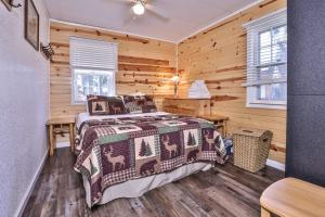 a bedroom with a bed and a wooden wall at West Bay Pines in Saint Germain +15 photos