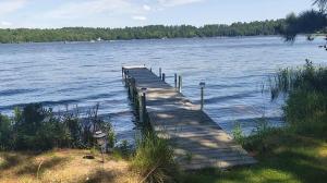 a dock in the middle of a large body of water at Catfish Cottage B in Eagle River
