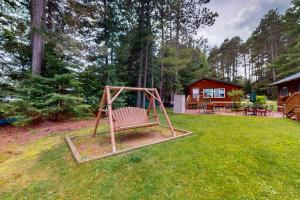 a playground in the yard of a house at Catfish Cottage B in Eagle River