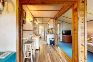 a kitchen and living room in a tiny house at Catfish Cottage B in Eagle River