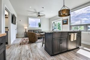 a kitchen with a large island with a counter top at The Studio in Minocqua