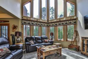 a living room with a couch and a table at Copperwood #1 in Eagle River