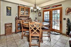 a kitchen with a wooden table and chairs at Copperwood #1 in Eagle River +19 photos