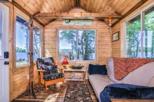 a living room with a couch and a table at The Nut House in Eagle River