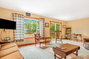 a living room with a couch and a table at Ashton House in Phelps