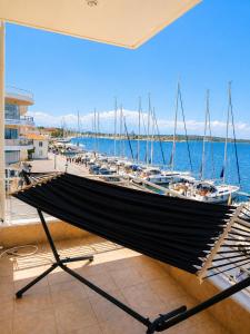 a boat on display in a room with a marina at AB Preveza Apartments-15 Meters Over the Sea Attic & Alexander's the Great Executive Suite in Preveza