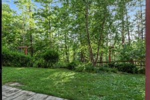 a yard with green grass and trees in the background at Chula Vista Condo Unit #2145 in Wisconsin Dells