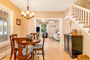 a dining room and living room with a table and chairs at The Blue Cottage in Minocqua