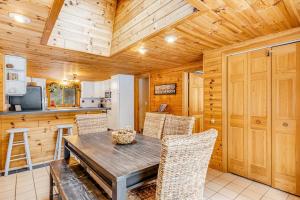 a kitchen and dining room with a table and chairs at The Haven in Eagle River