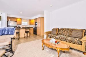 a living room with a couch and a table at Base Camp Eagle River in Eagle River