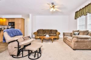 a living room with a couch and a table at Base Camp Eagle River in Eagle River