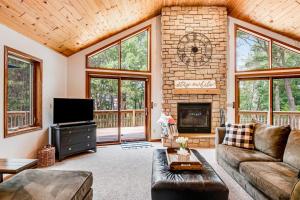 a living room with a couch and a fireplace at Peaceful Pines in New Rome +46 photos