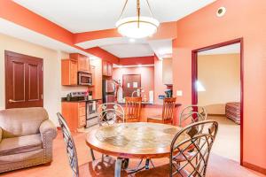 a kitchen and dining room with a table and chairs at Chula Vista Condo 2251 in Wisconsin Dells