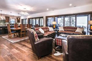 a large living room with couches and a dining room at Endless Summer in Sayner +58 photos