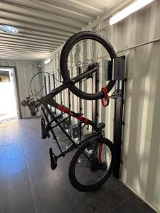 a bike in a bike rack in a garage at Araluen Motor Lodge in Batemans Bay