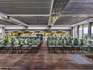 a row of chairs in a waiting room at ibis Jerusalem city Center - An AccorHotels Brand in Jerusalem