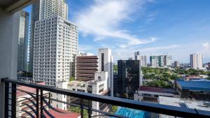 a view of a city skyline from a balcony at The Mosaic Tower Luxury Boutique Studio,Pool and Gym Fast Wifi in Manila