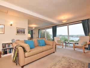 a living room with a couch with blue pillows at 3 Bed in Polruan oc-pc052 in Polruan