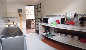 a kitchen with a stove and a counter top at Alójate Huánuco in Huánuco