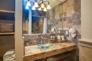 a bathroom with a sink and a mirror at Inn At Avila Beach in Avila Beach +31 photos