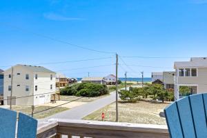 a view of the beach from the balcony of a house at 4011 - The Dog`s House in Kitty Hawk