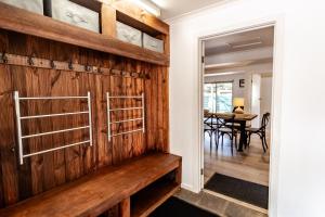 a barn door in a home with a wooden wall at Ovens River Retreat in Harrietville
