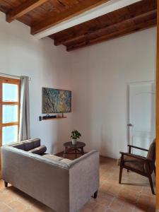 a living room with a couch and a chair at Loft Juárez in Amecameca de Juárez +3 photos