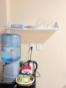 a shelf above a coffee maker with a container on it at APART LyM 2 in Clorinda
