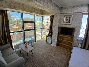 a living room with a couch and a fireplace at Gandan Peace Guest House in Ulaanbaatar