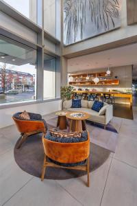 a living room with a couch and a table at art'otel cologne in Cologne