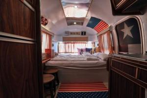 a small room with a bed in the middle at Out of Park in Chuncheon