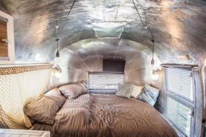 a bedroom with a bed in the middle of a tunnel at Out of Park in Chuncheon