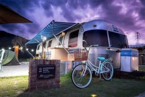 a bike parked in front of a trailer at Out of Park in Chuncheon