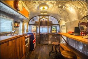 a kitchen of a train with a counter and a sink at Out of Park in Chuncheon +3 photos