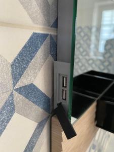 a corner of a wall with a electrical outlet at Sylvie Steinhardt, Wohnung 3 in List