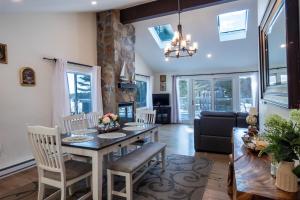 a kitchen and living room with a table and chairs at Sun Drenched Lakefront Cove in Monticello