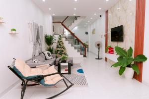 a living room filled with furniture and a christmas tree at HeavenVilla in Can Tho
