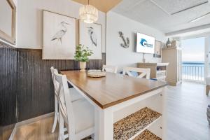 a dining room with a table and chairs at Amazing Large Private Studio Condo with Amazing View in Myrtle Beach