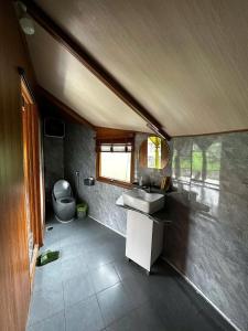 a small bathroom with a sink and a toilet at An's House homestay & Hagiang local tours in Ha Giang +100 photos