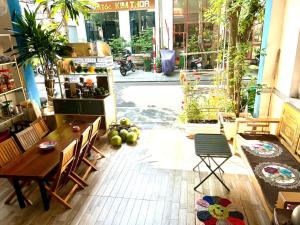 a restaurant with a table and chairs in a room at Ba Doan 2 in Con Dao