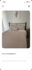 a bedroom with a large bed with at Guinevere2 in Myrtleford